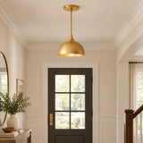 Delphi 1 light brass dome pendant featuring a sculptural rounded shade, slender brass stem and coordinating round ceiling canopy.