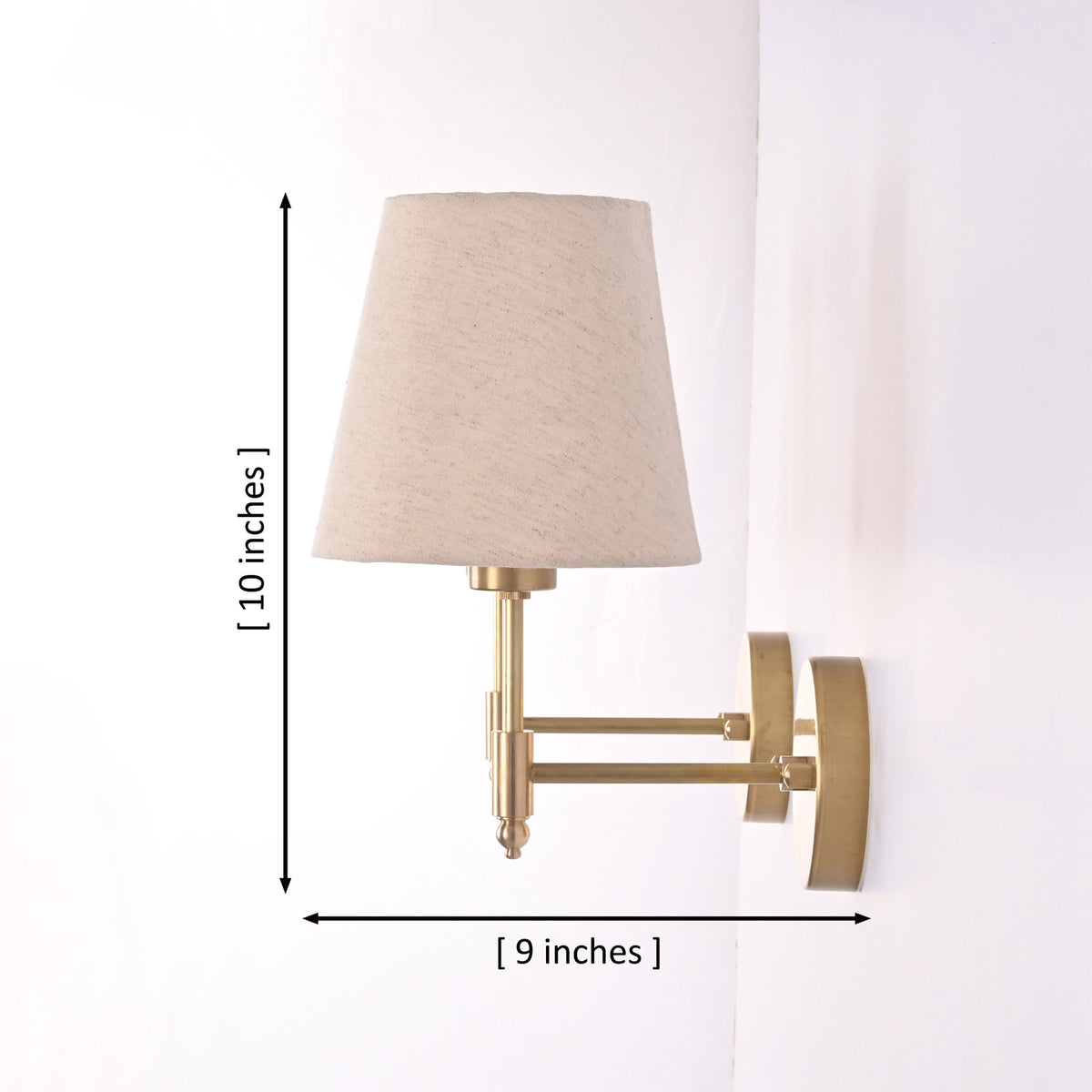 Dimensions of the Milan natural linen shade brushed brass wall sconce measuring 10 inches high with a 9-inch projection.