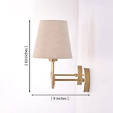 Dimensions of the Milan natural linen shade brushed brass wall sconce measuring 10 inches high with a 9-inch projection.