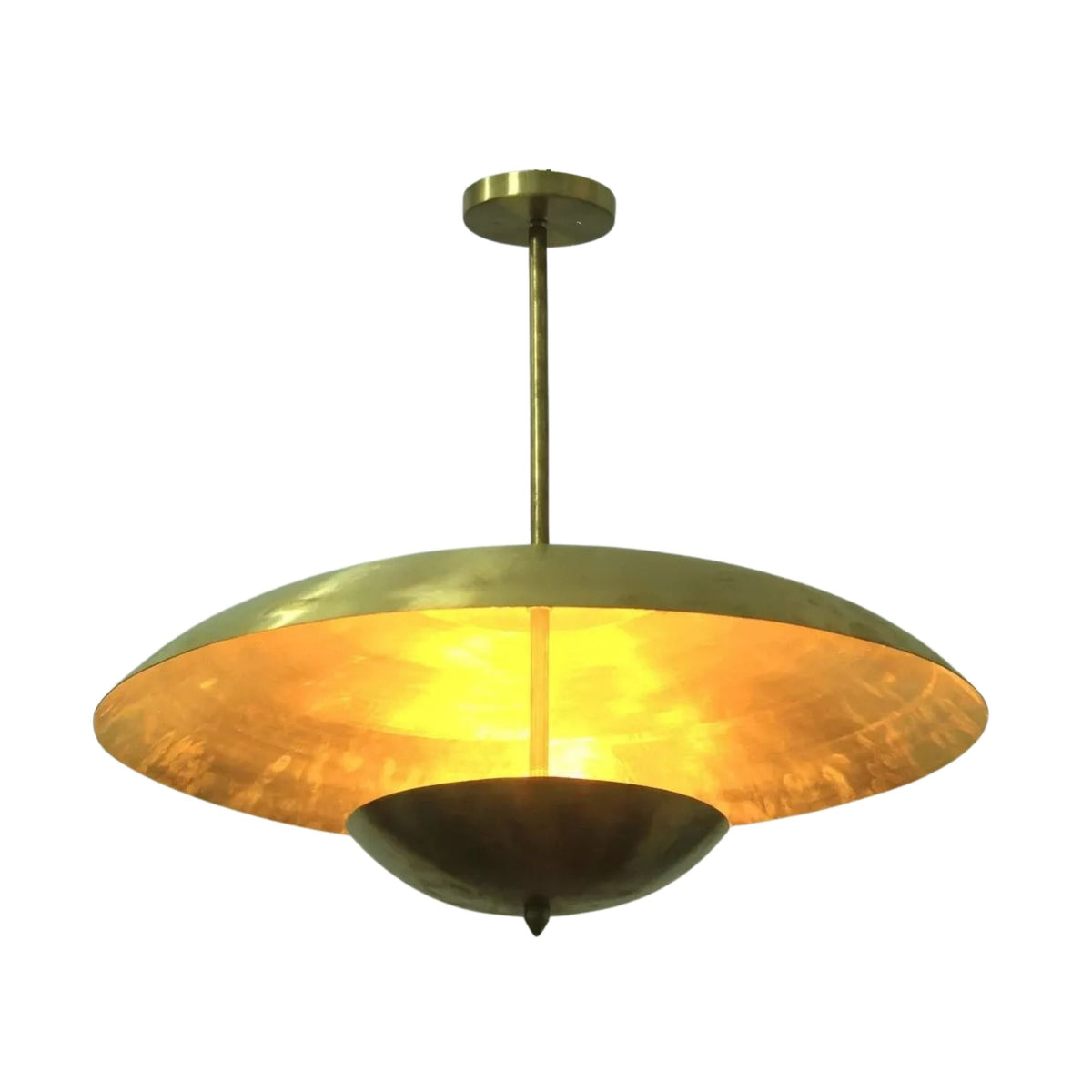 Dresden 4 light brass dome chandelier shown illuminated with warm light highlighting its layered sculptural metal design.