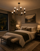Edinburgh 8 light black and brass two-tier chandelier displayed above a contemporary bedroom with warm ambient lighting.