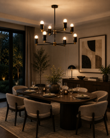 Edinburgh 8 light two-tier chandelier illuminating an elegant dining room with warm modern interior styling.