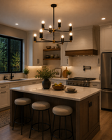 Edinburgh 8 light black and brass chandelier displayed above a modern kitchen island with warm ambient lighting.