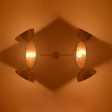 Florence Disc Orbital Chandelier ceiling view with four glowing disc shades and warm ambient light effect.
