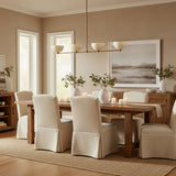 Florence 4 light Mid-Century Modern linear chandelier shown from the front with four evenly spaced cream bowl shades.