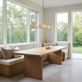 Florence 4 light linear bowl chandelier shown from the front with cream bowl shades and a warm brass-tone frame.