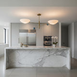 Geneva 2 light Mid-Century Modern chandelier shown from a side angle featuring white bowl shades, brass arms and blue sphere details.