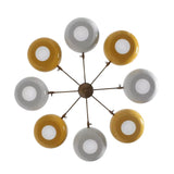 Bottom view of Genoa 8-light chandelier showing four yellow and four white bowl shades, circular light diffusers, and symmetrical brass-tone arms.