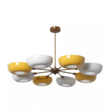Front view of Genoa 8-light chandelier showcasing alternating mustard yellow and white bowl shades, brass-tone metal arms, and a central ceiling downrod.