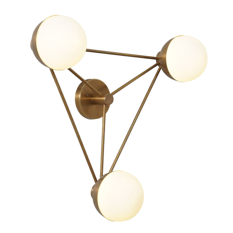 Angled view of brass geometric chandelier with three frosted globes forming a triangle, highlighting mid-century modern craftsmanship and warm illumination.