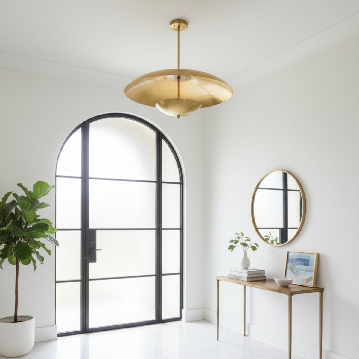 Hamptons 3 light sculptural chandelier shown from below highlighting the broad dome shade, suspended lower bowl, and brass-tone construction.