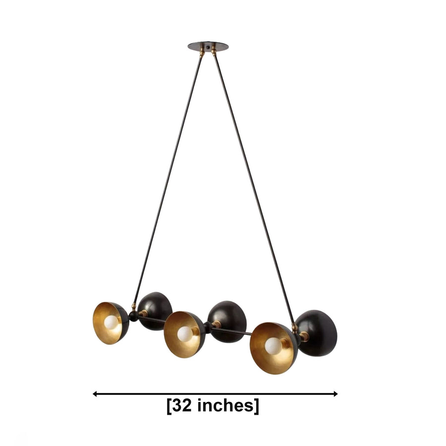 Modern multi-light chandelier with four black spherical shades and four brushed gold conical reflectors, suspended by black cords from a round ceiling canopy on a white background.