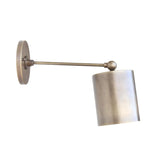 Hudson adjustable cylinder wall sconce featuring a handcrafted cylindrical metal shade, slim adjustable arm, and solid brass wall mount shown in angled front view.
