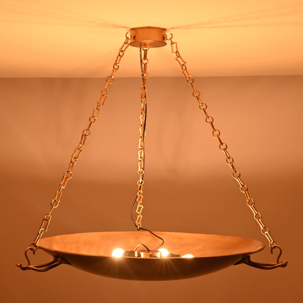 Interior view of the Hudson Artisan Bowl Chandelier showing the concealed light source within the handcrafted suspended bowl.