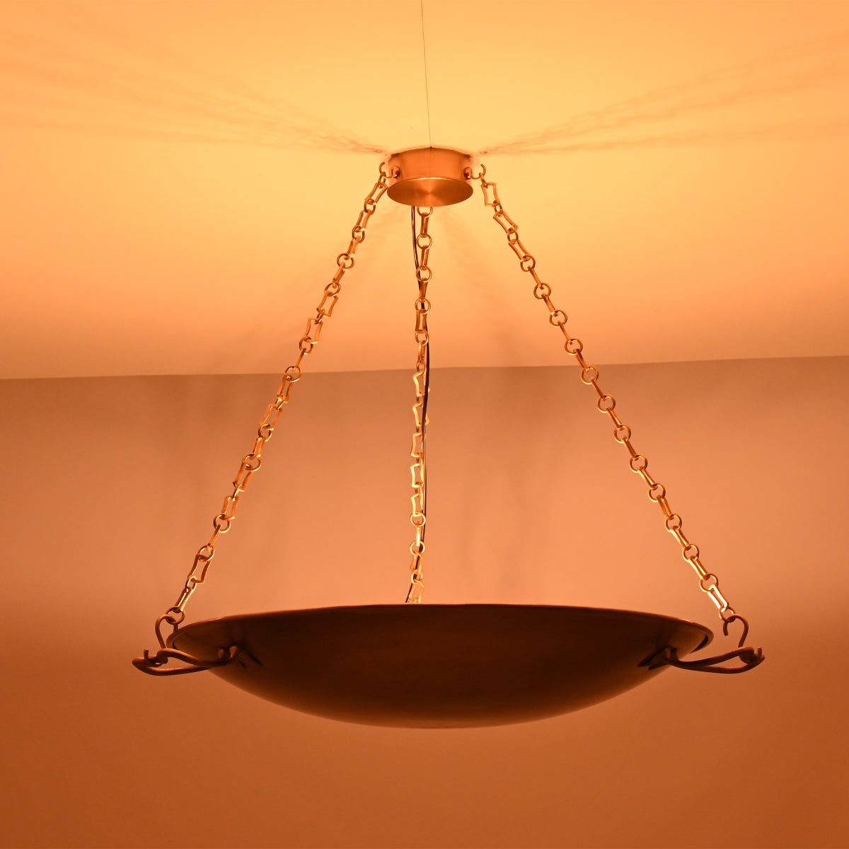 Side illuminated view of the Hudson Artisan Bowl Chandelier featuring decorative chain suspension and artisan-inspired bowl silhouette.