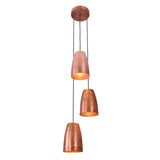 Perspective view of the Hudson Cascading Cone Cluster Pendant Light with three suspended copper cone pendants casting a warm ambient glow.