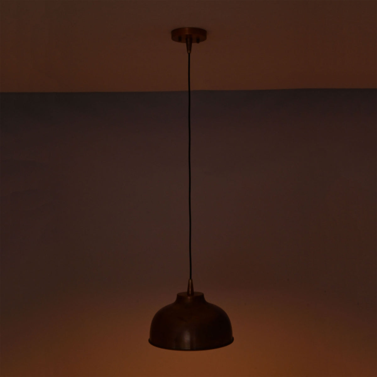 Hudson copper dome pendant light providing focused downward illumination with a warm copper reflection.