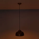 Hudson copper dome pendant light providing focused downward illumination with a warm copper reflection.