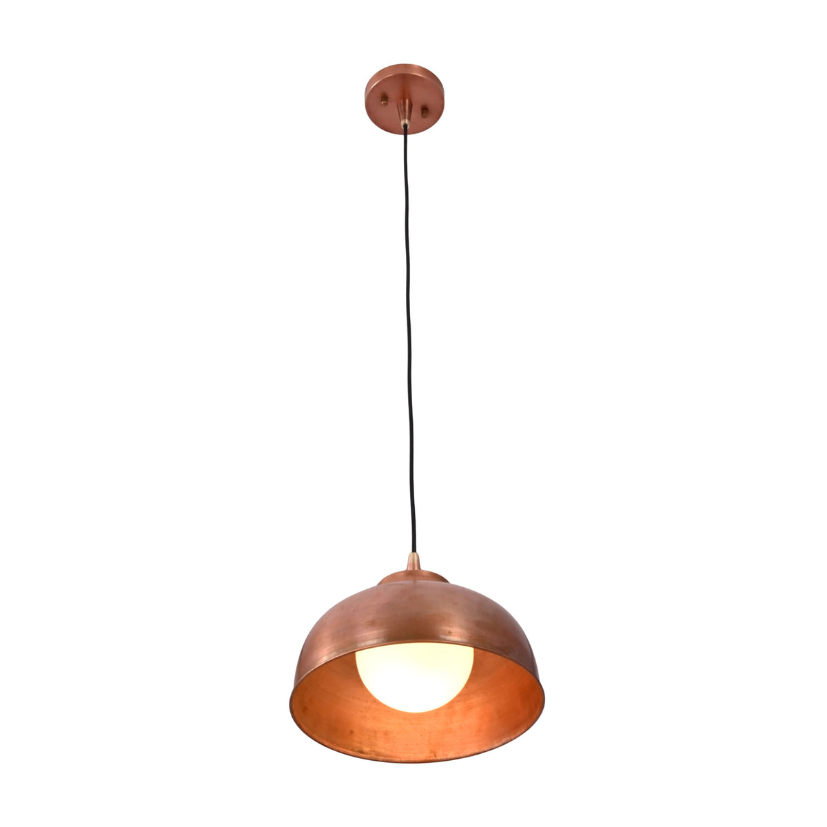 Angled view of Hudson copper dome pendant light illuminated with warm glow highlighting the copper interior.