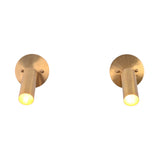 Front view of two Hudson Modern Brass Adjustable Cylinder Wall Sconces illuminated to showcase the focused downward beam and minimalist cylindrical design.