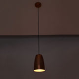 Hudson modern copper bell pendant lamp casting warm ambient light with adjustable ceiling suspension