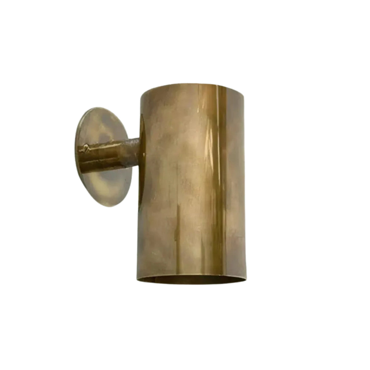 Hudson modern solid brass cylinder wall sconce front view with minimalist cylindrical shade and warm downward lighting.