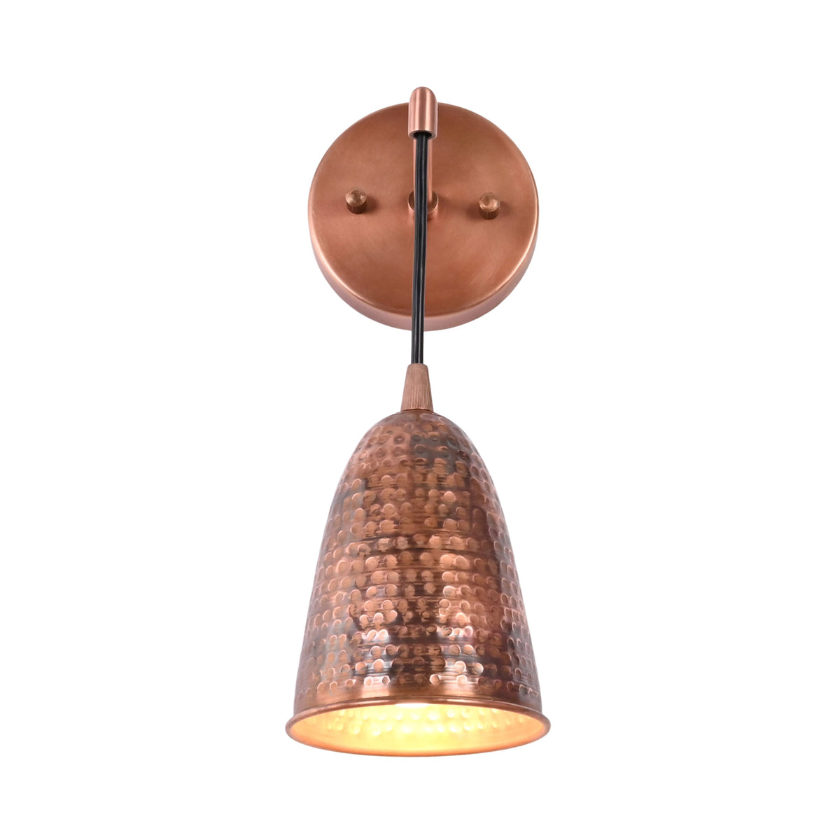 Front view of the Hudson Modern Hammered Copper Cone Wall Sconce illuminated with a warm LED glow, featuring a handcrafted hammered copper cone shade suspended from a minimalist black stem and round copper wall canopy.