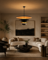 Hudson Modern Layered Disc Chandelier installed above a contemporary living room seating area, creating a sophisticated architectural focal point with warm ambient lighting.