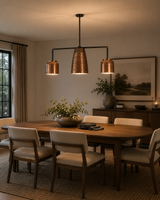 Hudson Modern Linear Three Shade Chandelier illuminating a contemporary dining room with a ribbed center shade and two cylindrical side shades.