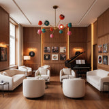 Hudson 12 light colorful Sputnik chandelier shown from an alternate angle highlighting its sculptural brass-tone arms and multicolor shades.