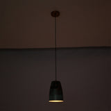 Hudson Verdigris Tapered Pendant Light casting warm focused downward illumination, highlighting its artisan verdigris patina and copper interior.