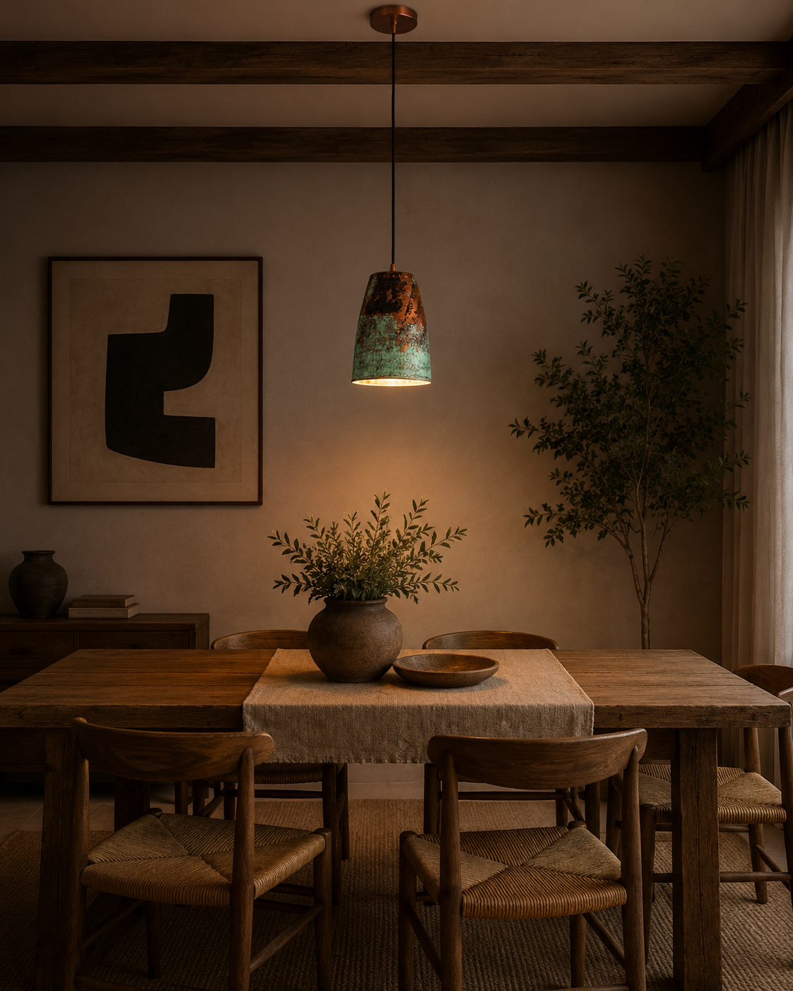 Hudson Verdigris Tapered Pendant Light installed above a rustic dining table, adding warm ambient lighting with its handcrafted verdigris patina and copper interior.