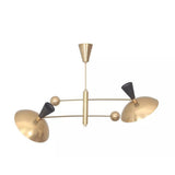 Ibiza 4 light brass-tone sculptural chandelier shown from an angled view with asymmetric arms, dome shades, and black cone details.