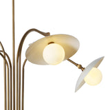 Close-up of a brass chandelier’s frosted glass shade and globe light, showcasing fine metal craftsmanship and warm illumination