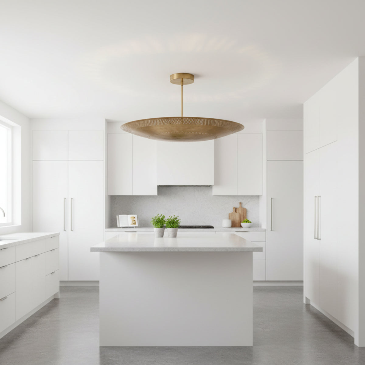 Kyoto 5 light sculptural disc chandelier shown from an alternate side view with perforated metal detailing and a warm brass-tone finish.