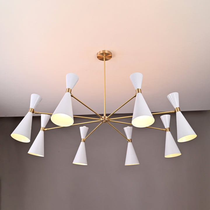 Elegant brass chandelier with white cone lampshades, mid-century modern style, mounted on a white ceiling with gray backdrop