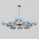 Front view of the Lecce 10-light chandelier showcasing rounded sky-blue bowl shades, warm brass-tone metal arms, and a central downrod suspension.