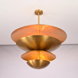 Angled perspective of the Lior Modern Tiered Disc Chandelier highlighting its sculptural tiered disc silhouette and modern design