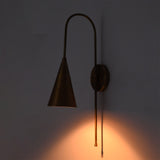 Close front view of Liora Cone Loop Wall Sconce showing focused warm light from the tapered cone shade.