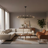 Lucca 18 light Mid-Century Sputnik chandelier featuring black radial arms, brass-tone socket holders, and a rounded central hub.
