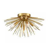 Lucerne 5 light brass-tone starburst ceiling light shown from an angled view with layered radial rods and exposed bulbs.