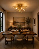Lucerne 5 light brass starburst flush mount displayed above a wooden dining table in a warm contemporary dining room.