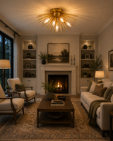 Lucerne 5 light brass starburst flush mount illuminating a warm elegant living room with fireplace and Mid-Century inspired furniture.