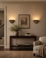 Pair of Luna Fluted Scalloped Flush Mount Ceiling Lights installed in a contemporary living room, providing warm ambient illumination with elegant handcrafted metal shades.