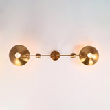 Bottom view of the Luna Modern Double Bowl Chandelier highlighting symmetrical bowl shades, spherical counterweights, and two-light design