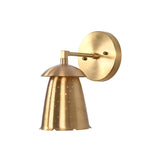 Angled view of Luna perforated bell wall sconce showing curved shade cap and round wall plate.