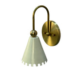 Rear angled view of the Luna Scalloped Cone Wall Sconce showcasing the round brass backplate, curved arm, decorative sphere, and white scalloped cone shade.