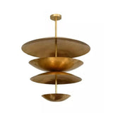Mallorca 8 light brass-tone sculptural chandelier shown from an angled view featuring layered disc and bowl-shaped shades.