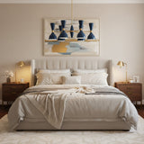 Manhattan 12 light chandelier shown from the side with deep blue hourglass-inspired shades and slender brass-tone arms.