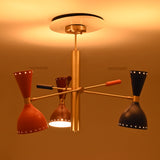 Front view of Manhattan 6-light Sputnik chandelier with orange, brown, and blue metal shades, brass-tone ribbed central column, and warm illumination.